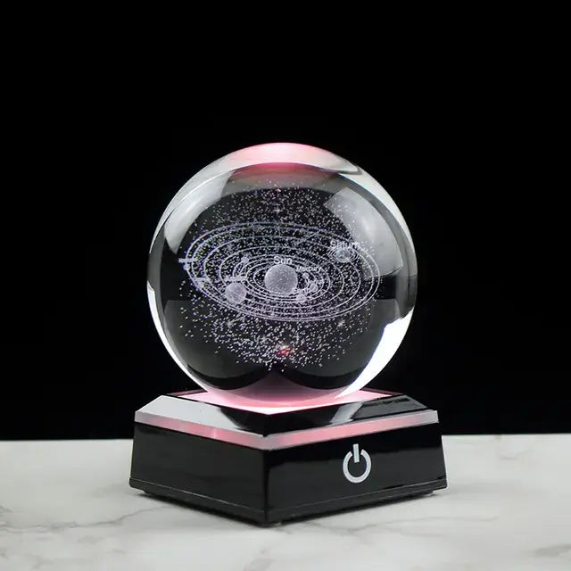 3D Crystal Galaxy Ball on a black base, displaying a mini-universe with illuminated stars and planets.