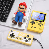 Retro Mini Handheld Game Console on desk with a gaming controller and toy figure