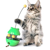 Cat playing with Interactive Cat Treat Ball, a green toy for fun and snacks