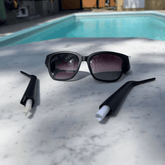 Hidden Storage Sunglasses with detachable arms shown revealing secret compartments for small items, perfect for discreet storage.