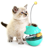 Kitten playing with Interactive Cat Treat Ball, designed for play, hunt, and snack activities.