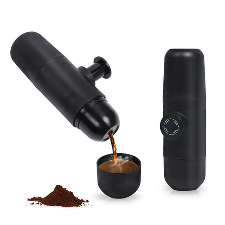 Portable Manual Espresso Maker brewing coffee, compact design, ideal for travel with up to 20 bars of pressure, black color.