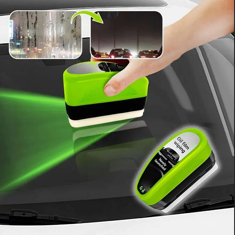 Green Oil Film Wipe effectively cleaning glass, showcasing clarity and ease of use in an automotive setting.