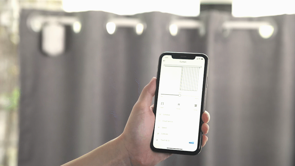 User controlling Smart Curtain Robot with phone app, upgrading existing curtains to smart curtains.