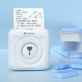 PeriPage Pocket Printer printing a geometric diagram, showcasing its compact and inkless thermal printing capabilities.