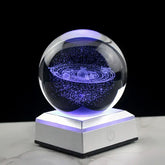 3D Crystal Galaxy Ball illuminating with a cosmic design on a lit base, perfect for decorative desk display or gifting.