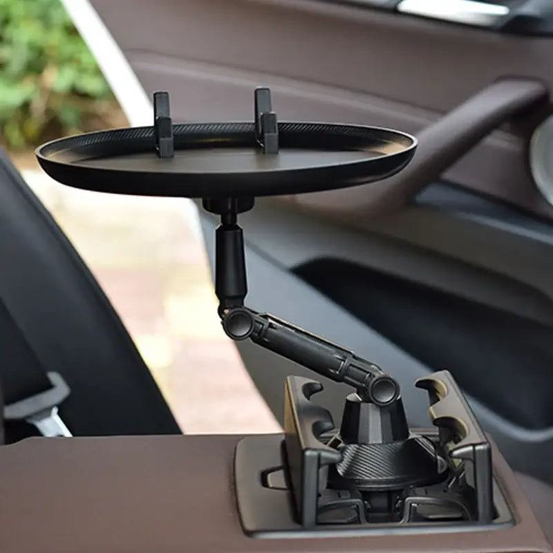 Car Swivel Tray installed in a vehicle cup holder, transforming it into a mini table for convenience during travel.