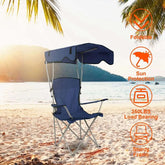 Camping Chair with Canopy set up on the beach, featuring sun protection and sturdy frame for outdoor relaxation.
