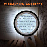 30X LED Magnifying Glass with 12 bright LED lamp beads illuminating text in a book, perfect for reading small print clearly.