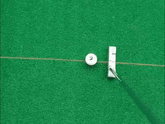 Golf Laser Putting Trainer showing precise alignment line on green surface