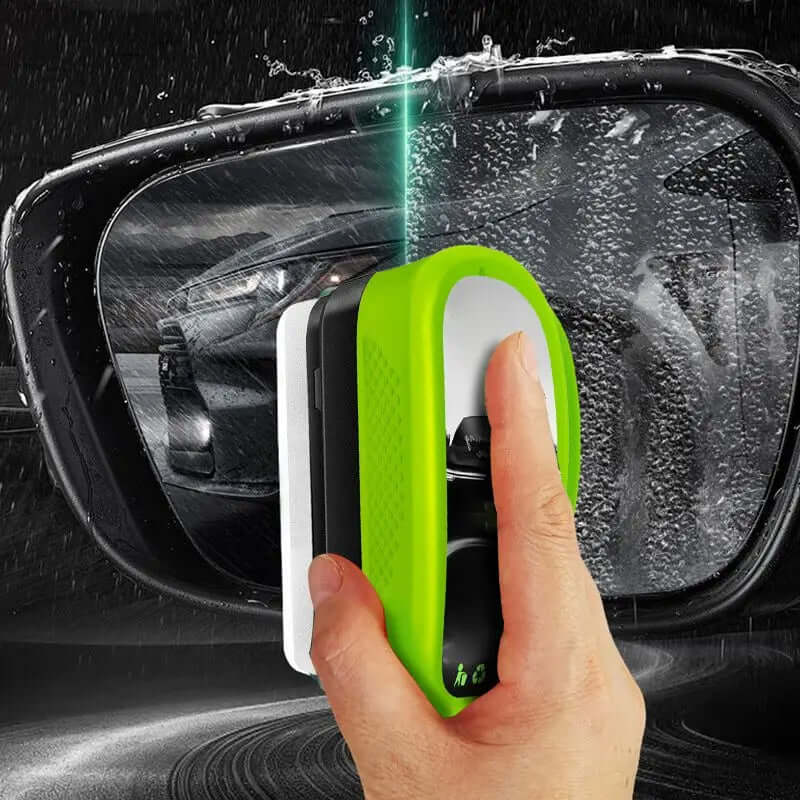 Using the Green Oil Film Wipe to clean a car mirror for crystal clear glass in seconds.
