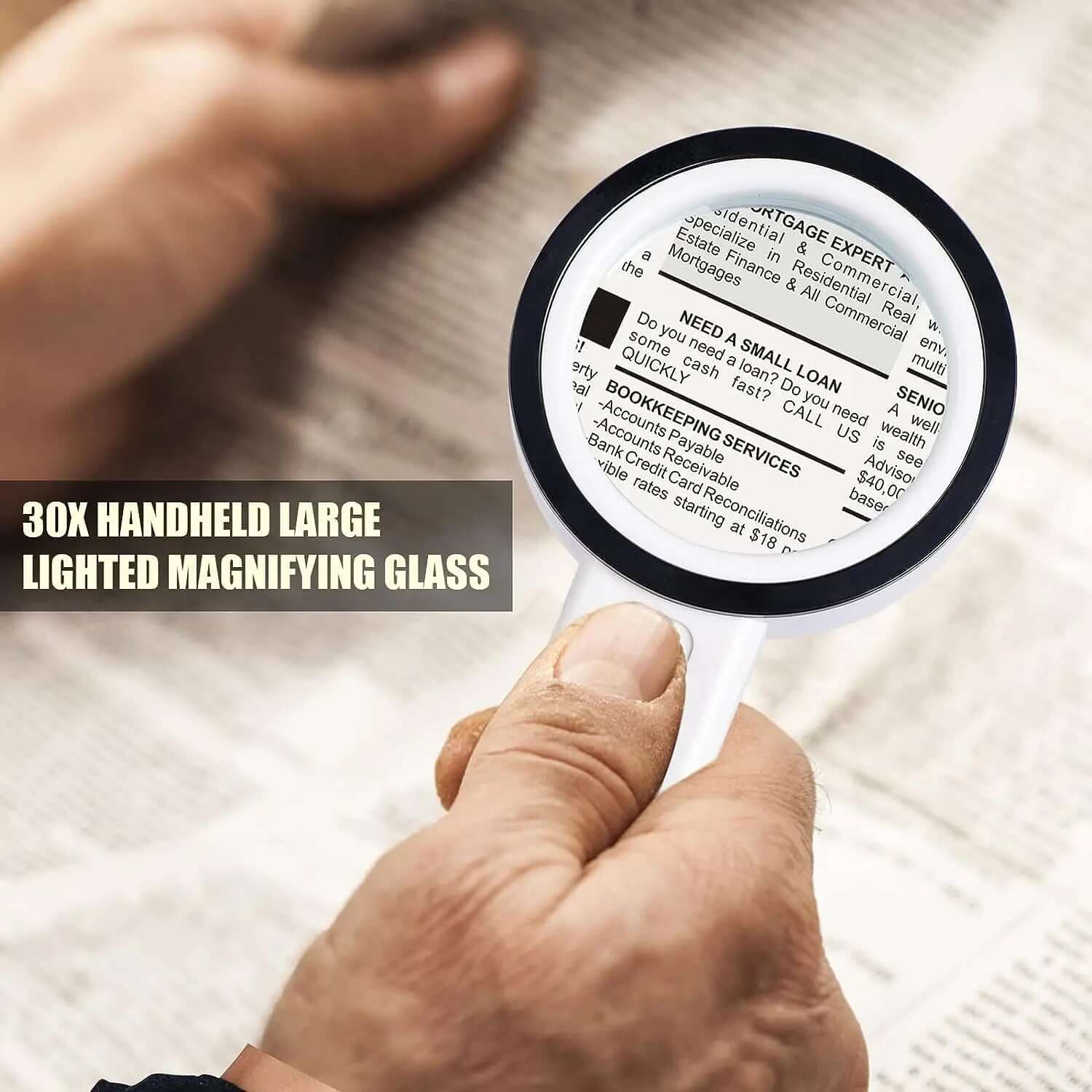Person using a 30X LED Magnifying Glass to read fine print on a newspaper.