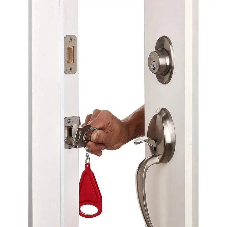 Smart Portable Door Guard in use, providing added security to a door with a person installing it.