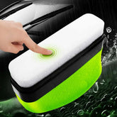 Green Oil Film Wipe used for cleaning crystal clear glass with a hand pressing on the wipe.