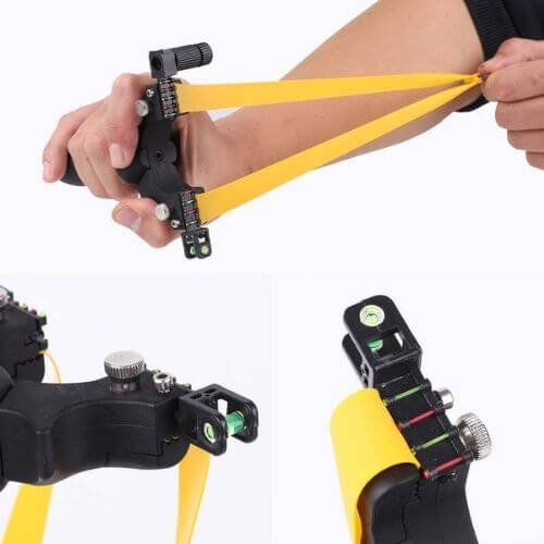 Person using a Laser Guided Slingshot with precision sight and yellow band, showcasing tactical aiming features.